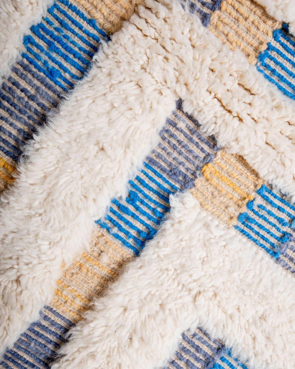 Modern, designer, handcrafted Berber rug from Morocco. Beniourain carpet with beautiful colours and patterns and fluffy wool texture.